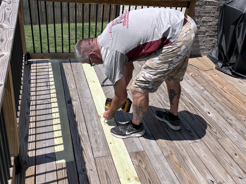 Replacing worn deck boards on a Central Arkansas deck