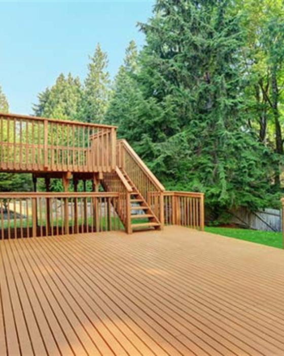 Multi-tier deck construction on sloped terrain in Central Arkansas