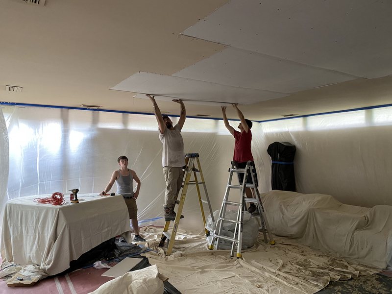 JT's crew hanging new drywall on a ceiling in a Central Arkansas home