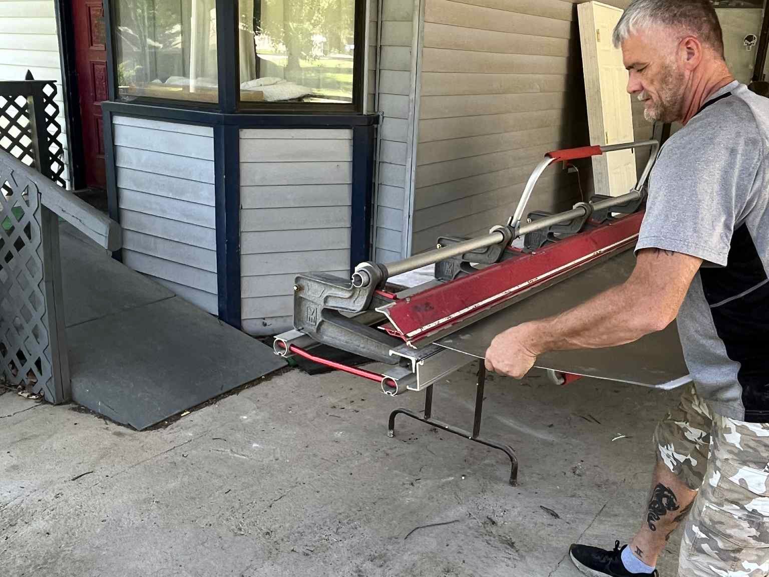 JT's Home Repair cutting siding trim on a job in Central Arkansas