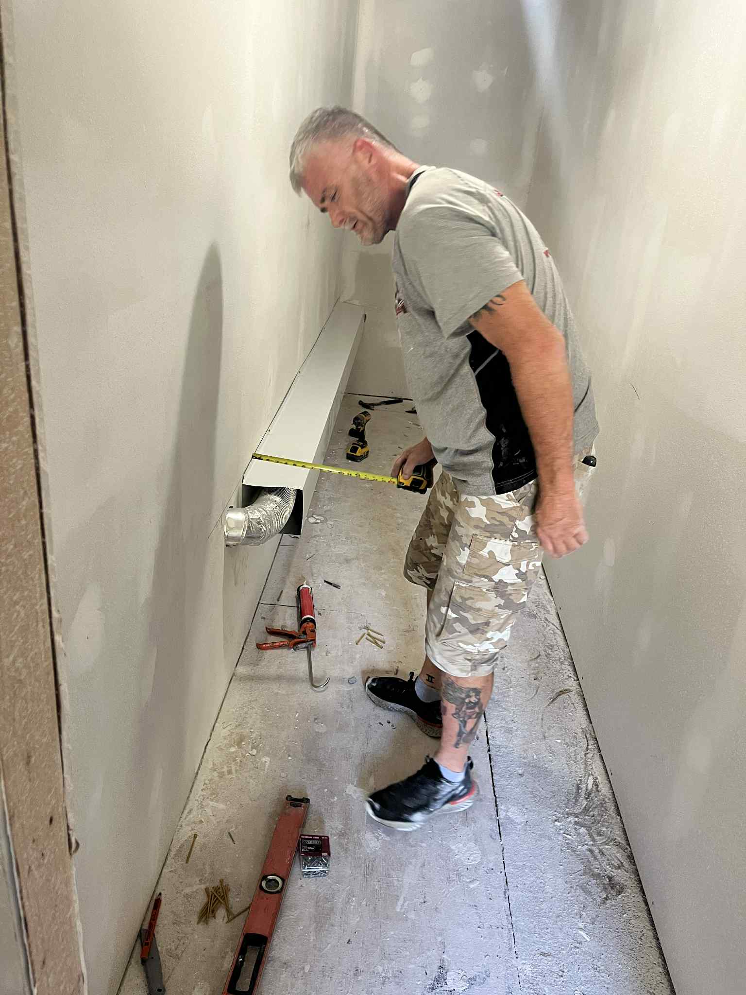 JT measuring during a home remodeling job in Central Arkansas
