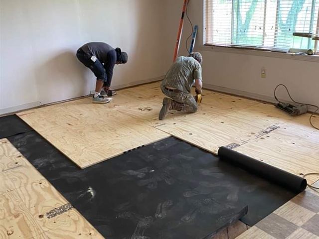New flooring boards over a reinforced subfloor in Central Arkansas